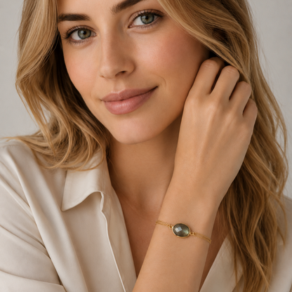Woman wearing a gold labradorite bracelet 