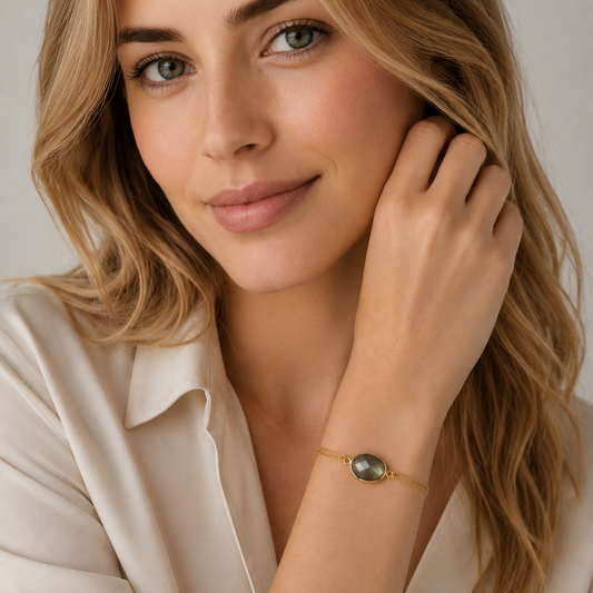Woman wearing a gold labradorite bracelet 
